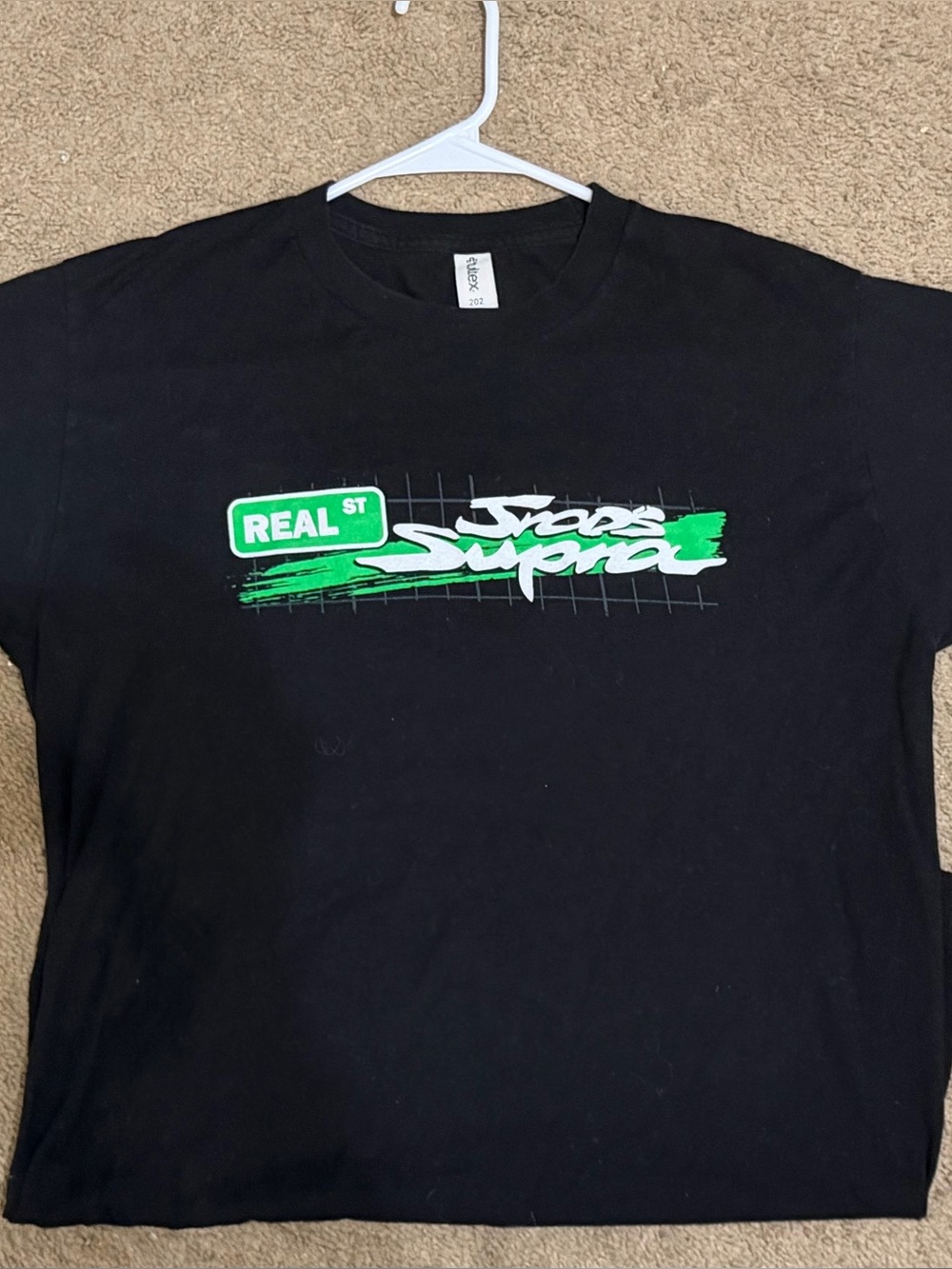 Black Graphic Tee with Green 'Real St' Script